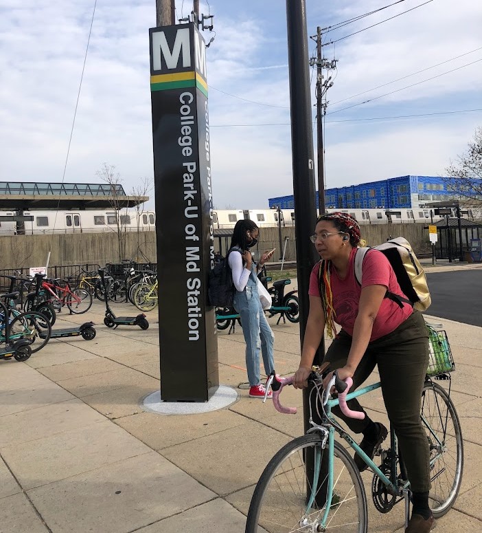 College Park Metro pylon and people, bike